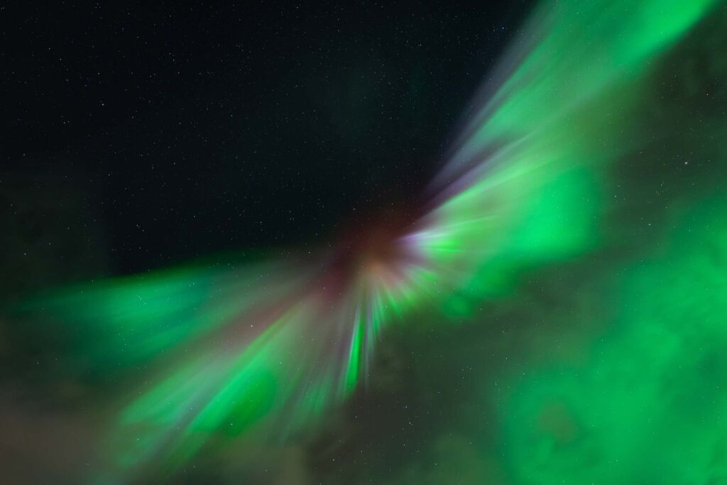 Aurora corona with green Northern Lights above Tromsø, Northern Norway