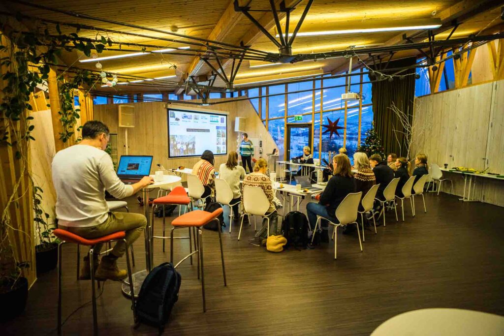 Conference room at Tromsø Villmarkssenter with guests attending a presentation in Tromsø, Northern Norway.